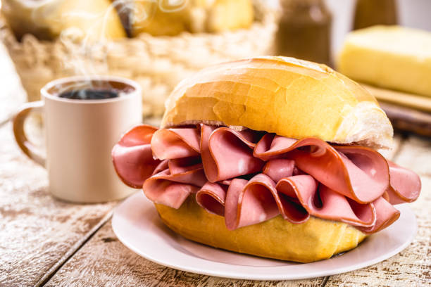 Traditional mortadella sandwich, pork served in bakeries in Brazil with black coffee stock photo
