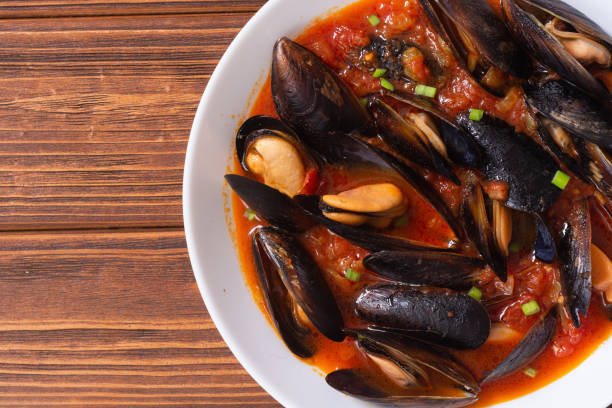 Traditional mussels tomato soup stock photo