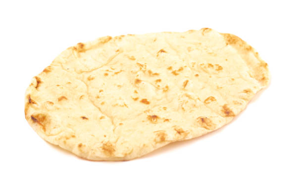 Traditional Naan Bread Perfect for Paring with a Curry Dinner Traditional Naan Bread Perfect for Paring with a Curry Dinner naan bread stock pictures, royalty-free photos & images