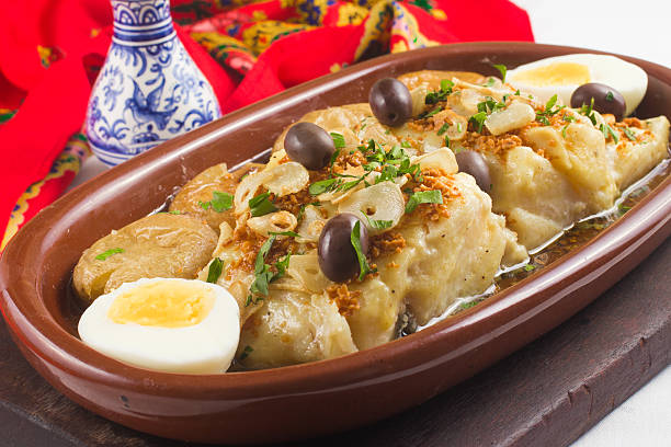 Traditional Portuguese Cod Traditional Portuguese Cod with nozete potatoes and olives portuguese culture stock pictures, royalty-free photos & images