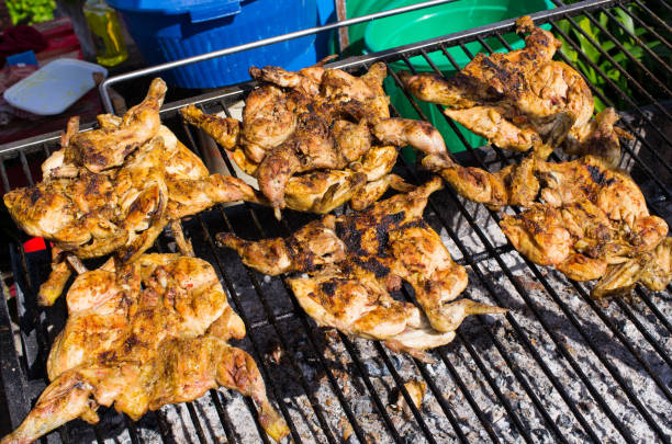 Traditional portuguese piri piri chicken on the BBQ stock photo