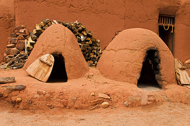 traditional pueblo clay ovens - cooking step by step bildbanksfoton och bilder