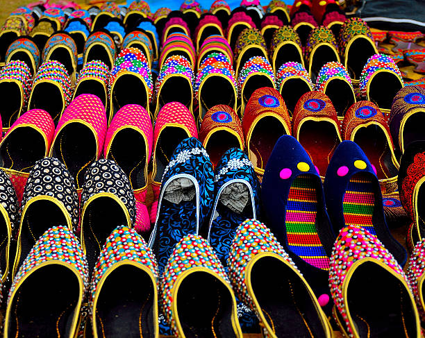 Traditional Rajasthani footwear I found these aesthetically aligned chappals(footwear) on the streets of Jaipur,the capital of Rajasthan. kota rajasthan stock pictures, royalty-free photos & images