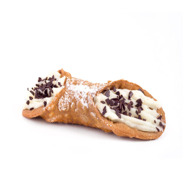 Traditional sicilian cannoli Traditional sicilian cannoli with ricotta cream and chocolate flakes cannoli stock pictures, royalty-free photos & images