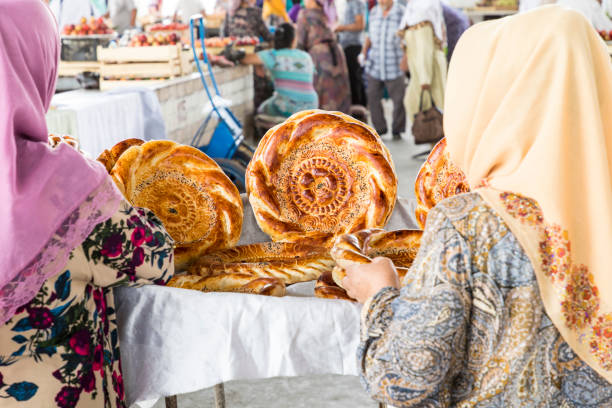 Traditional uzbekistan bread lavash at local bazaar, is a soft flat-bread of Middle Asia (Uzbekistan). Traditional uzbekistan bread lavash at local bazaar, is a soft flat-bread of Middle Asia (Uzbekistan). bukhara stock pictures, royalty-free photos & images