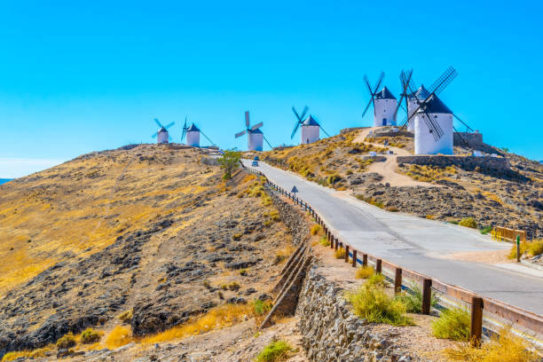 Traditional white windmills at Consuegra in Spain Traditional white windmills at Consuegra in Spain castilla y león stock pictures, royalty-free photos & images
