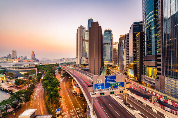 Traffic at bridge with sunset downtown in Hong Kong stock photo