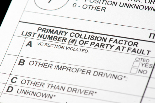 A close up view of a traffic collision report form. The portion of the report indicates which driver is at fault for the collision.