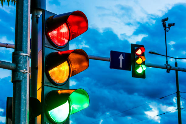 Traffic lights over urban intersection stock photo