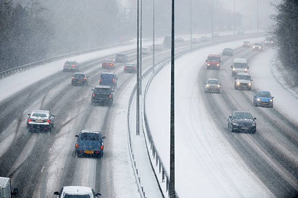 Traffic On Motorway During Snowstorm stock photo