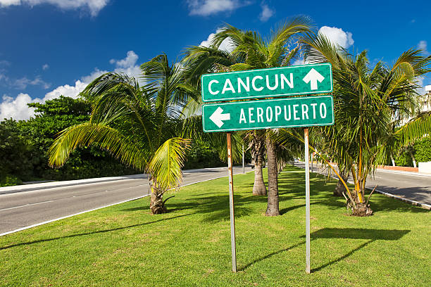 Traffic Sign Airport or Cancun with arrows on the street stock photo