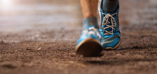 Trail running action Trail running action close up of running shoes in action cross country running stock pictures, royalty-free photos & images