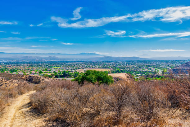 Trails above California suburbs stock photo