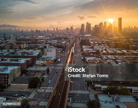 istock Train passing trough Sunnyside Queen during sunset in New York, USA 1329893020