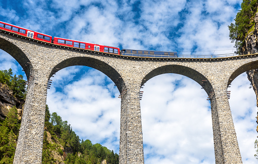 Train runs on Landwasser Viaduct, Filisur, Switzerland.
