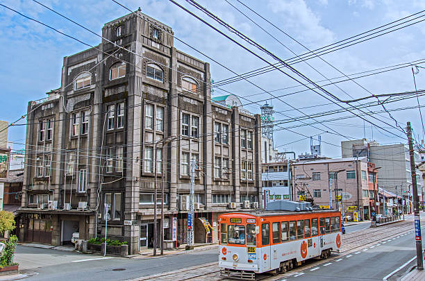 Tram and vintage buildings in Kumamoto City stock photo