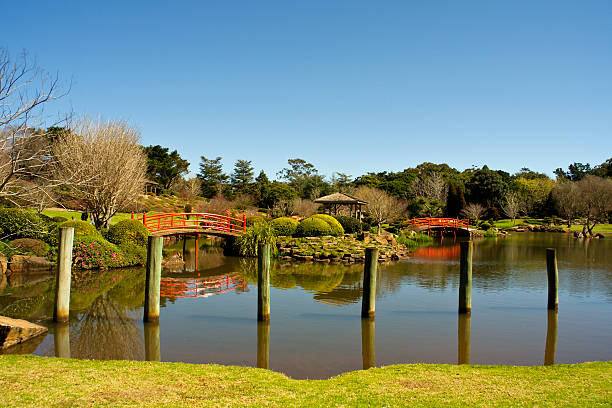 Tranquil Lake with Orange Bridges stock photo