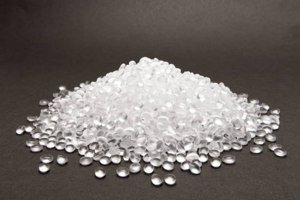 Transparent Polyethylene granules on dark .HDPE Plastic pellets.  Plastic Raw material . IDPE. stock photo