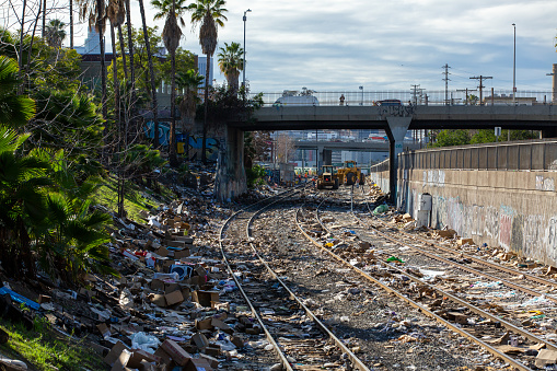 Thieves hit a cargo train in the Lincoln Heights neighborhood, resulting in trash all over the tracks. A train later derailed because of this. The tracks were closed and seen here are the crews cleaning up the mess.