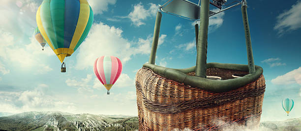 Travel and Tourism. Colorful hot-air balloons flying over the mountain. stock photo