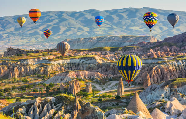 Travel concept. The great tourist attraction of Cappadocia - balloon flight. Cappadocia is known around the world as one of the best places to fly with hot air balloons. Goreme, Cappadocia, Turkey. Artistic picture. Beauty world. Travel concept. The great tourist attraction of Cappadocia - balloon flight. Cappadocia is known around the world as one of the best places to fly with hot air balloons. Goreme, Cappadocia, Turkey. Artistic picture. Beauty world. rock hoodoo stock pictures, royalty-free photos & images