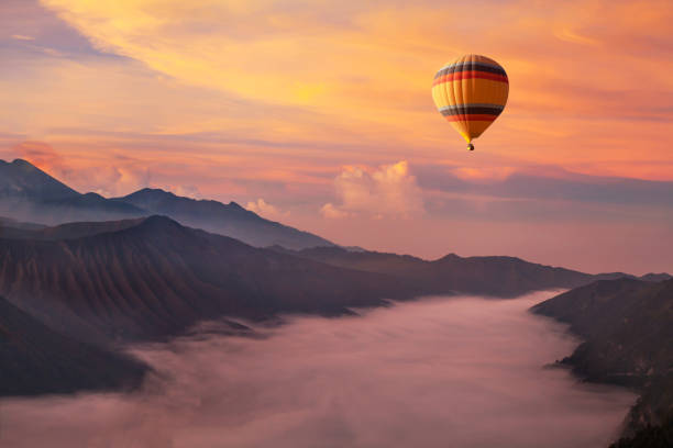 travel on hot air balloon, beautiful inspirational landscape travel on hot air balloon, beautiful inspirational landscape with sunrise colorful sky cloudscape photos stock pictures, royalty-free photos & images
