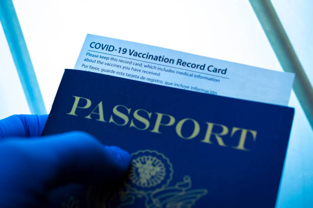 COVID Travel Passport with COVID-19 vaccination card. cdc vaccine card stock pictures, royalty-free photos & images