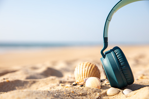 travel vacation and music concept on the beach