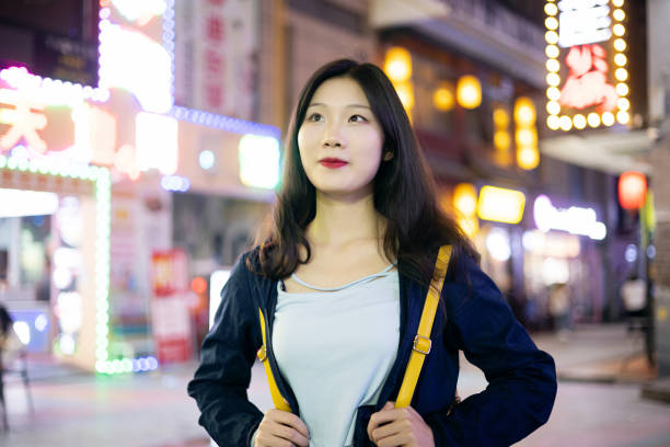 Traveler asian woman travel at night street stock photo