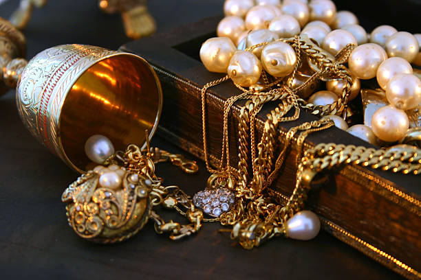 Treasure Jewellery laying over an indian jewellery box.See similar pictures: Jewelry: indian jewelry stock pictures, royalty-free photos & images
