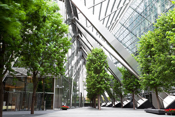 Trees and Office Buildings walkway in office park, green color stock pictures, royalty-free photos & images