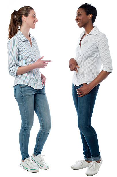 Trendy young women having a discussion stock photo