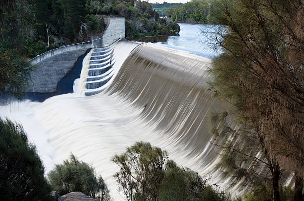 Trevallyn dam in flood Trevallyn dam with floodwater cascading over spillway. Launceston, Tasmania, Australia launceston australia stock pictures, royalty-free photos & images