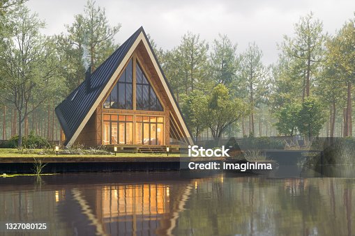 istock Triangular Modern Lake House At Fall 1327080125