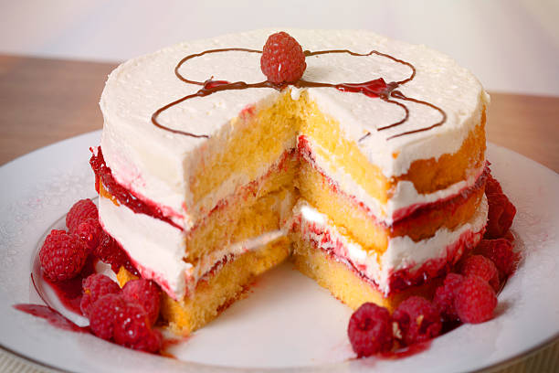 Triple Layer Cake with Raspberry and Frosting Filling stock photo