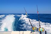 istock Trolling fishing boat rod and golden saltwater reels 1334927846