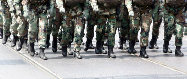 Troops marching Troops marching militia stock pictures, royalty-free photos & images