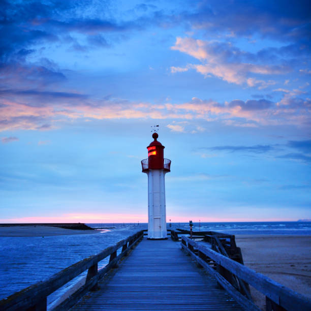Trouville-sur-Mer Lighthouse, France Lighthouse in Trouville-sur-Mer harbor, Normandy, France. Composite photo calvados stock pictures, royalty-free photos & images