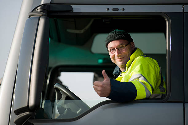 Truck driver Middle aged man sitting in cabin of semi truck.  truck driver stock pictures, royalty-free photos & images