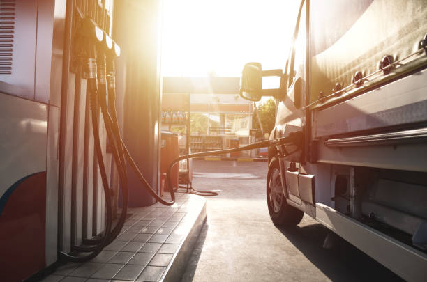 Truck refueling on a petrol station Truck refueling on a petrol station diesel fuel stock pictures, royalty-free photos & images