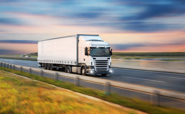 Truck with container on road, cargo transportation concept. stock photo