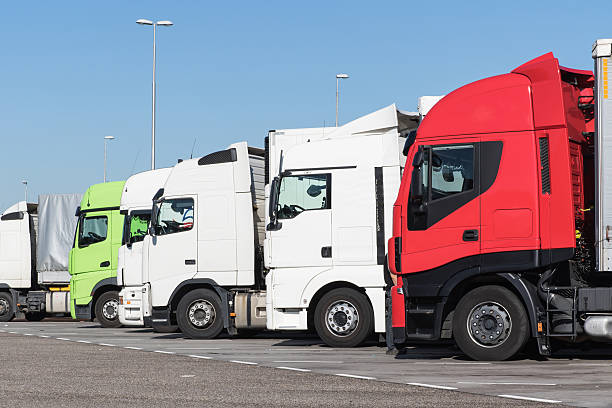 Trucks are standing in a row on the car park stock photo