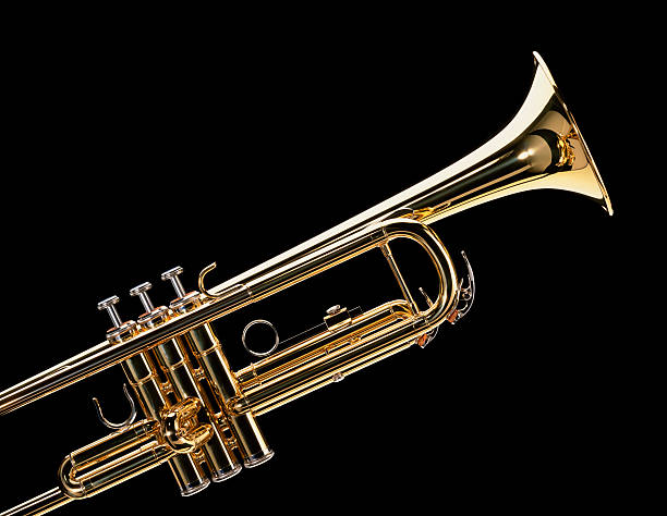Trumpet Close-up of a Trumpet on Black Background wind instrument stock pictures, royalty-free photos & images
