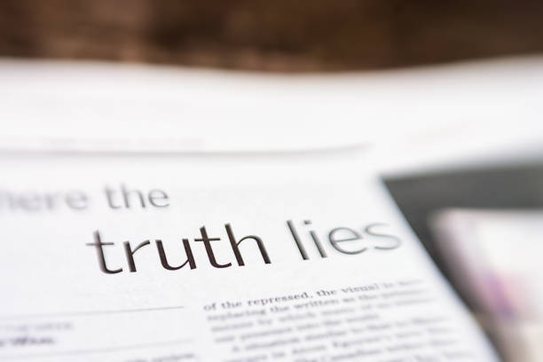 Truth and lies: newspaper headline about fake news stock photo