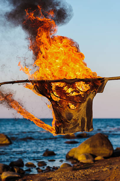T-shirt in flame stock photo