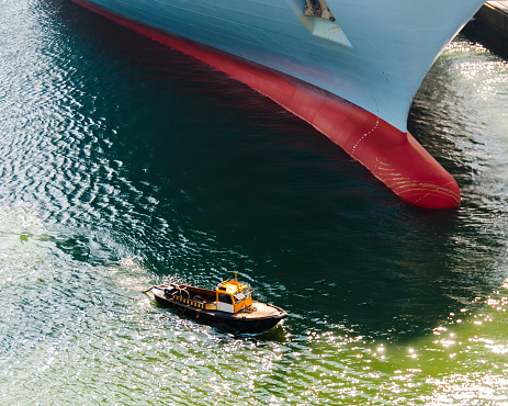 Tugboat and Container Ship – David and Goliath