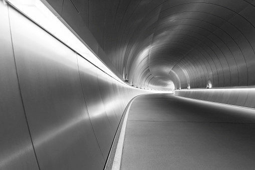 Empty futuristic modern tunnel in the dark