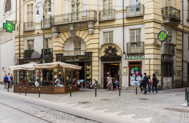 Turin, Italy. Street in the old town with a pastry shop and an old pharmacy stock photo