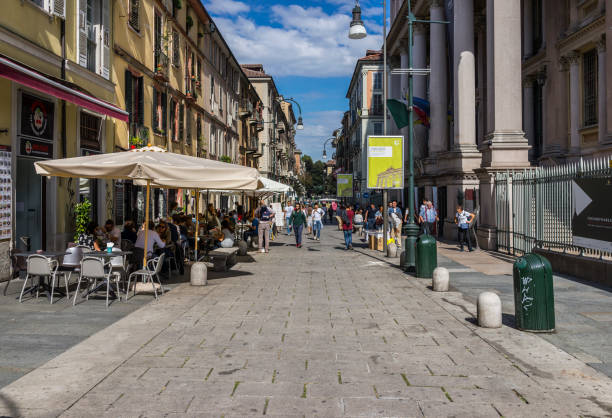 Turin, Italy. Via Montebello, with an outdoor restaurant and people walking stock photo