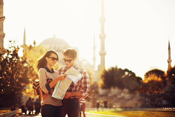 Turkish Couple Use Paper Map stock photo